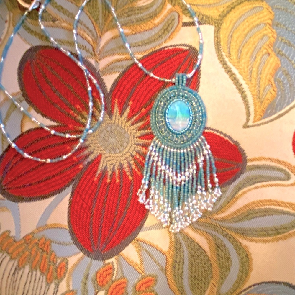 Hand beaded cabachon with fringe